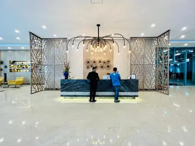 two men standing at a wine bar in a lobby at BGC High Rise, Uptown Mall Link, 5G WiFi, Pool, Ste 19 in Manila