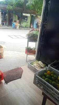 a display of fruit and vegetables in baskets on a street at Dream hotel in Manila