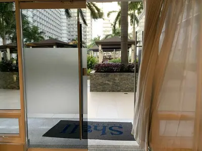 an open door to a building with a sign on it at Shell Residence 2 bedroom by Kathy in Manila