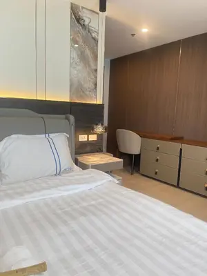 a bedroom with a bed and a dresser and a desk at La Venezia Executive Home, 3 Bedroom, 7 adults Maximum plus Kids in Manila