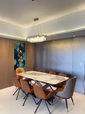 a dining room with a table and chairs at La Venezia Executive Home, 3 Bedroom, 7 adults Maximum plus Kids in Manila