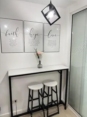 a bar with two stools in a room at Condotels SMB West Road in Manila