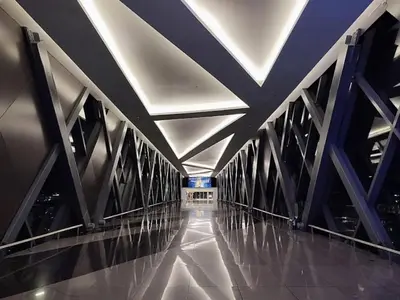 a bridge with a ceiling and a long hallway at One Palm Tree Villas-Hyuna Place Across Naia T3 Manila in Manila