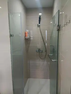 a shower with a glass door in a bathroom at Cluster 4 7G in Manila