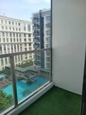 a balcony with a view of a large building at Cluster 4 7G in Manila