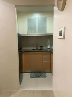 a small kitchen with a sink and a counter at Cluster 4 5D in Manila