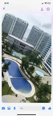 a picture of a large pool in front of a building at azure urban resort residences in Manila