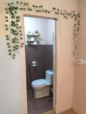 a bathroom with a toilet in a small room at Jace Haven 1 Room 2 Beds in Binangonan