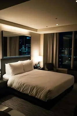 a hotel room with a large bed and a window at Light residence in Manila