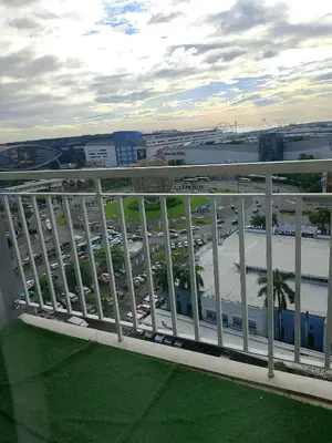 a balcony with a view of a parking lot at 1648 b 3beds big cut moa view in Manila