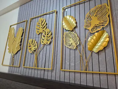 a bunch of yellow paper flowers on a wall at Newport Staycation in Manila