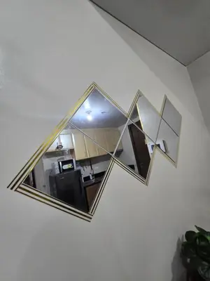 a mirror hanging on a wall in a room at Newport Staycation in Manila