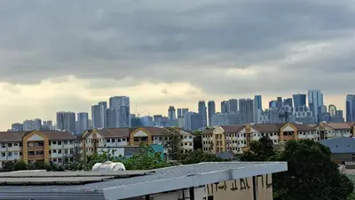 a view of a city skyline with tall buildings at CORKA Manila in Manila