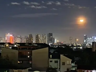 a view of a city skyline at night at CORKA Manila in Manila