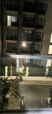 a view from a window of a building at night at Cozy Modern Studio Two Palm Tree Villas in Manila