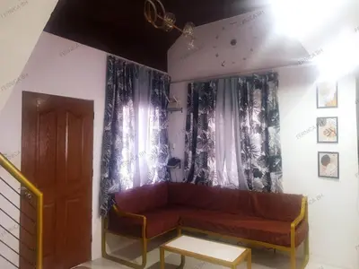 a living room with a couch and a window at Fernica Boarding House in Bancal