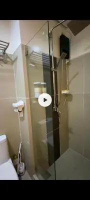 a shower with a glass door in a bathroom at ASV Condo Staycation SMDC Breeze in Manila