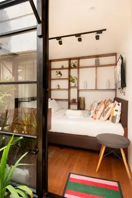 a bedroom with a bed and a window at Container Home Mandaluyong N08 in Manila