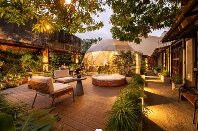 a garden with a large glass dome in a building at Container Home Mandaluyong N10 in Manila