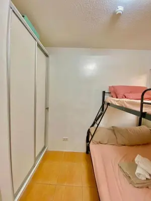 a small room with two bunk beds in it at Your Comfort Zone Staycation2 in Manila