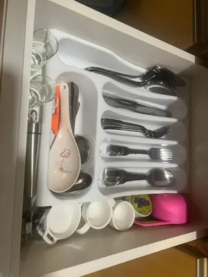 a drawer filled with utensils and utensils at McKinley viceroy Haven with free indoor parking in Manila