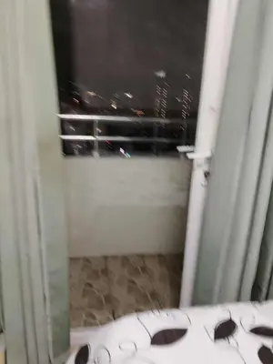a bathroom with a window with sunglasses on the floor at Birch tower condo for renting in Manila