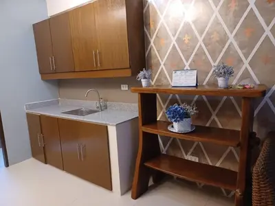 a small kitchen with a sink and a counter at 88 Residences in Manila