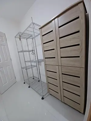 a room with a dresser and a ladder next to a cabinet at 88 Residences in Manila