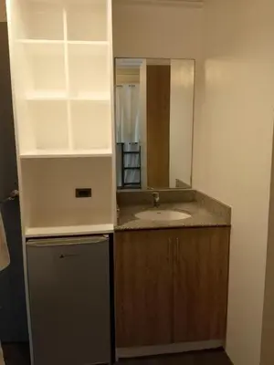a bathroom with a sink and a mirror at Quarto Ph in Manila