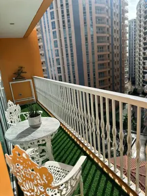 a balcony with a table and chairs on a balcony at Modern 1 bedroom spacious apartment with Venice Grand Canal View in Manila