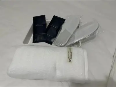 a white plate with towels and a roll of paper towels at MOA Condotel 1BR fast WiFi in Manila