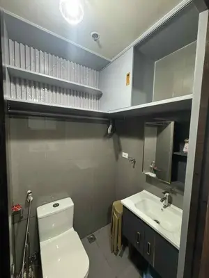 a bathroom with a white toilet and a sink at Air Residences 2111k'Pads in Manila