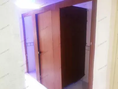 an open wooden door in a room at Fernica Boarding House in Carmona
