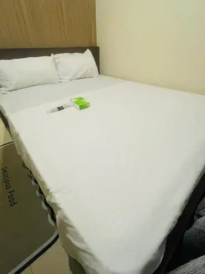 a large white bed with a price tag on it at Pasay City-Shore Staycation Ph in Manila