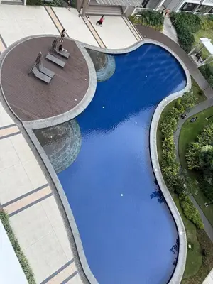 an overhead view of a swimming pool in a building at Stylish Cozy Nordic 2BR Netflix & Free Parking in Manila