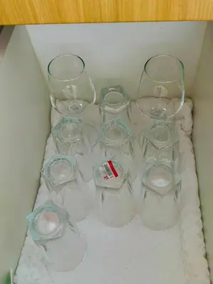 a box with four empty glasses on a towel at High-Floor Stay near Okada, Airport, City of Dreams, Solaire and MOA with free pool and gym access in Manila