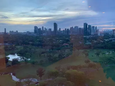 an aerial view of a park with a city at Luxurious Taguig Apartment with Private Pool and Central AC in Manila