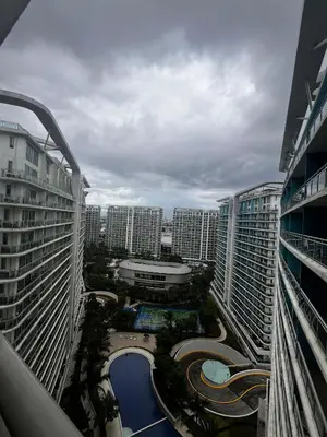 a view from a balcony of a city with tall buildings at Zyron Suite in Manila
