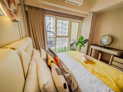 a bedroom with a couch and a large window at Spacious & Luxury 4BR Home across Okada and Solaire in Manila