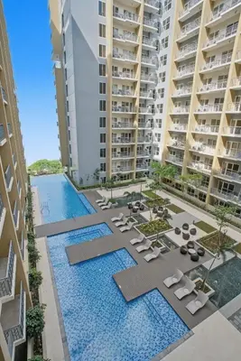 an aerial view of an apartment complex with a swimming pool at Modern and Spacious 3BR Home near Solaire & Okada in Manila