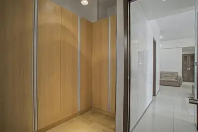 a hallway with a sliding glass door in a house at Modern and Spacious 3BR Home near Solaire & Okada in Manila
