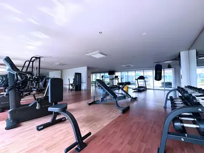 a gym with treadmills and elliptical machines at 120SQM 3Bedrooms with Balcony Facing Infinity Pool Manila Bay Sunset, Near Airports, OKADA, Solaire, MOA with Free Parking in Manila