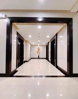 a hallway of a building with a chandelier at 120 Sqm Modern 3Bedrooms HighRise Facing Manila Bay, Near Airports, Okada Casino, Solaire Casino, MOA with free parking in Manila