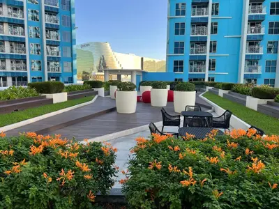 a patio in the middle of a building with benches and flowers at 120 Sqm Modern 3Bedrooms HighRise Facing Manila Bay, Near Airports, Okada Casino, Solaire Casino, MOA with free parking in Manila