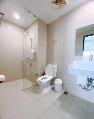 a bathroom with a toilet and a shower and a sink at 120 Sqm 3Bedrooms Facing Manila Bay Sunset, Airports, Okada, Solaire, MOA, free parking in Manila