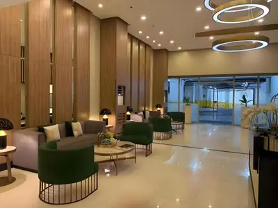 a lobby with couches and chairs in a building at 120 Sqm 3Bedrooms Facing Manila Bay Sunset, Airports, Okada, Solaire, MOA, free parking in Manila