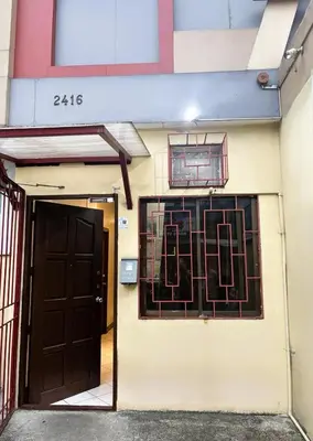 a building with a door and two windows at Makati Avenue Suites in Manila