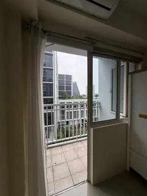 an open door to a balcony with a view at Shore Homestay in Manila