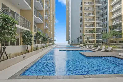 an infinity pool in the middle of a building at Luxury Home near Solaire and Okada Manila in Manila