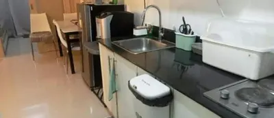a kitchen with a sink and a counter top at Sea Residence 2026 in Manila